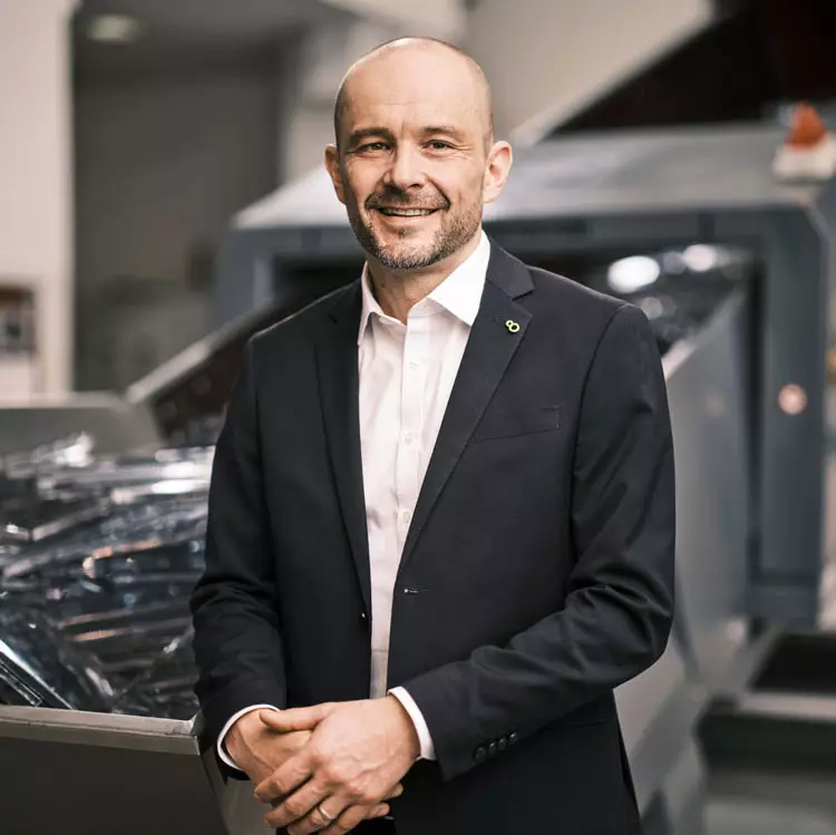 Dr. Gerold Breuer Managing Director of PURE LOOP in front of the ISEC evo.