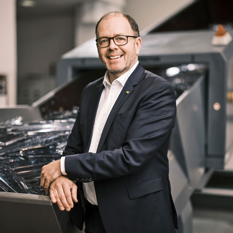 Ing. Manfred Dobersberger Managing Director of PURE LOOP in front of the ISEC evo. 